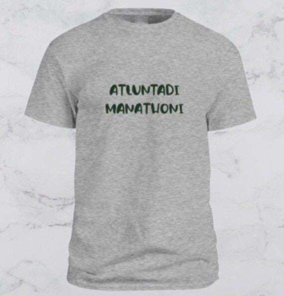 Gray t-shirt with the Telugu phrase 'Atluntadi Manathoni' printed in dark green.  Expressive, cultural pride design on a comfortable t-shirt.