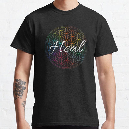 Black T-Shirt with a colorful Flower of Life pattern and the word "Heal" written in white script in the center.