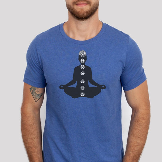 Blue heather T-Shirt with a black silhouette graphic of a person in a meditation pose, displaying the seven chakra symbols along their spine.