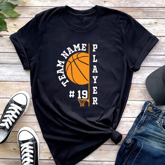 Black t-shirt with "Team Name" and "Player" text, basketball graphic, and "#19", styled with shoes and jeans.