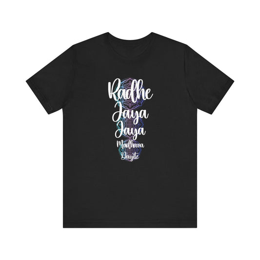 Black t-shirt with the text "Radhe Jaya Jaya Madhava Dayite" in a stylized white font with a faint floral pattern in the background.