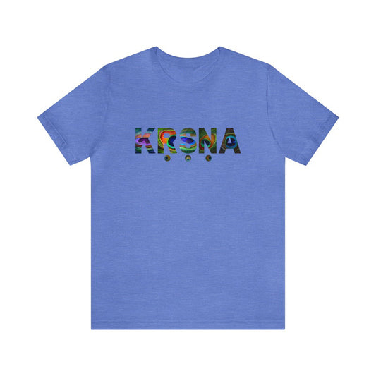 Light blue jersey tee with "KRSNA" text in a vibrant, multi-colored, abstract design.