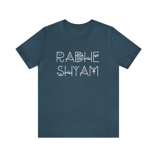 Dark teal t-shirt with the words "Radhe Shyam" in a stylized white font with subtle botanical line art integrated into the letters.