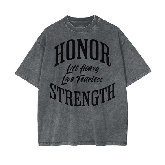A gray t-shirt with "Honor," "Lift Heavy," "Live Fearless," and "Strength" in bold black lettering.