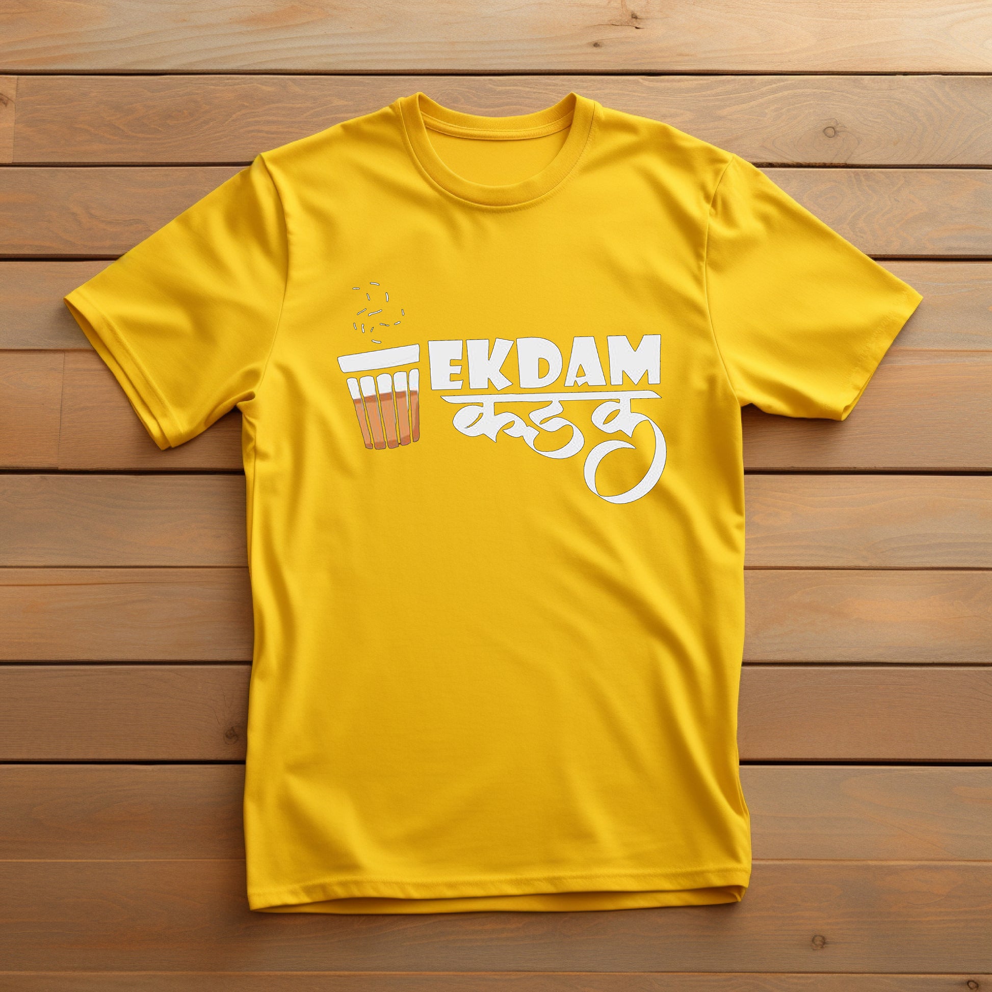 Bright yellow t-shirt with the Marathi phrase "EKDAM कडक" and a tea glass graphic printed in white.